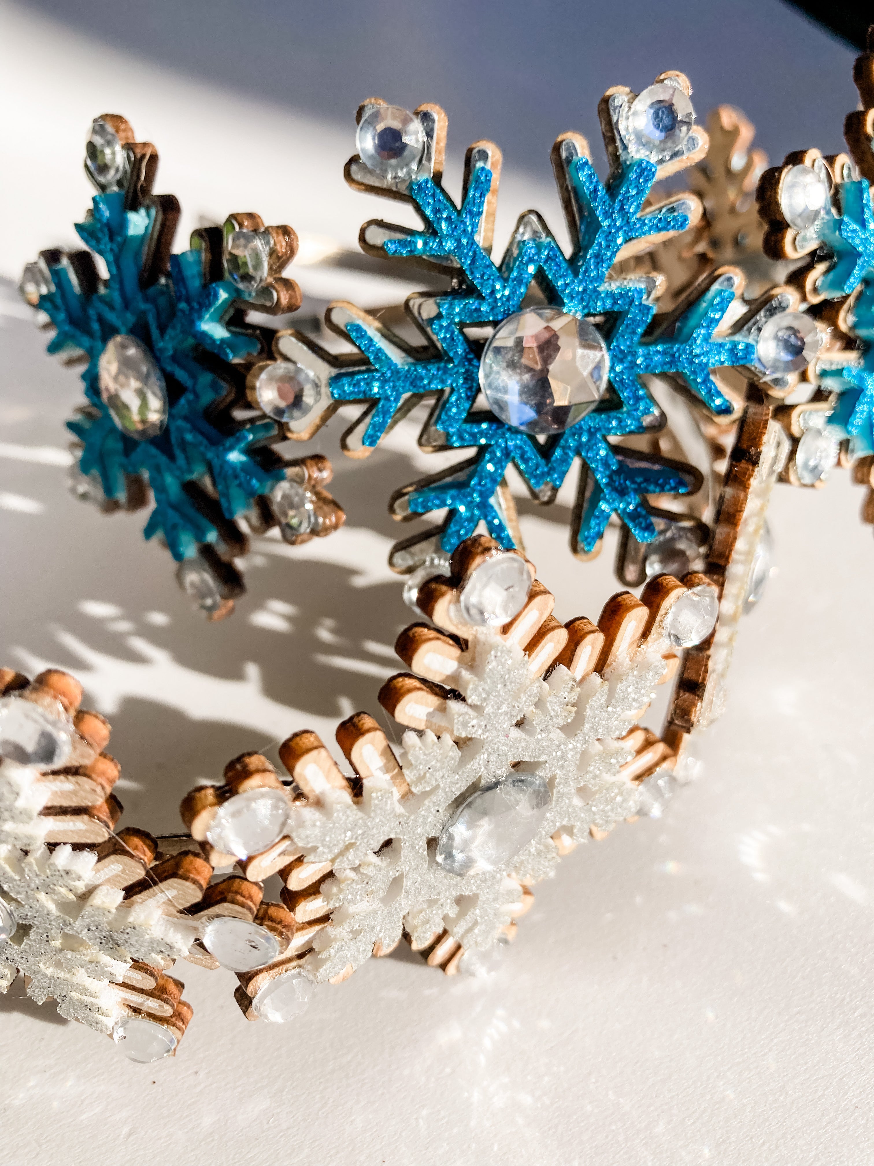 Silver and blue sparkling diamonte and glitter snowflake shaped crowns